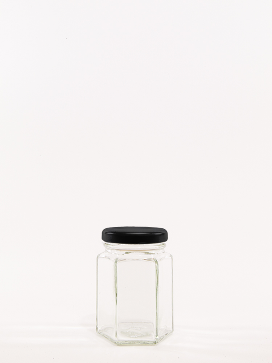 https://www.jazjar.co.uk/cdn/shop/products/4oz-Hexagonal-Jar-with-Black-Lid.png?v=1629895065&width=533